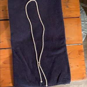 Woman’s pearl necklace